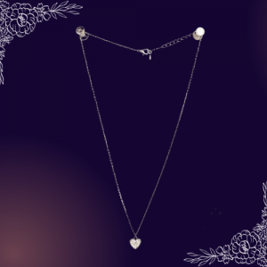 Sweet and trendy! This necklace is cast in silver-tone metal with a heart pendant